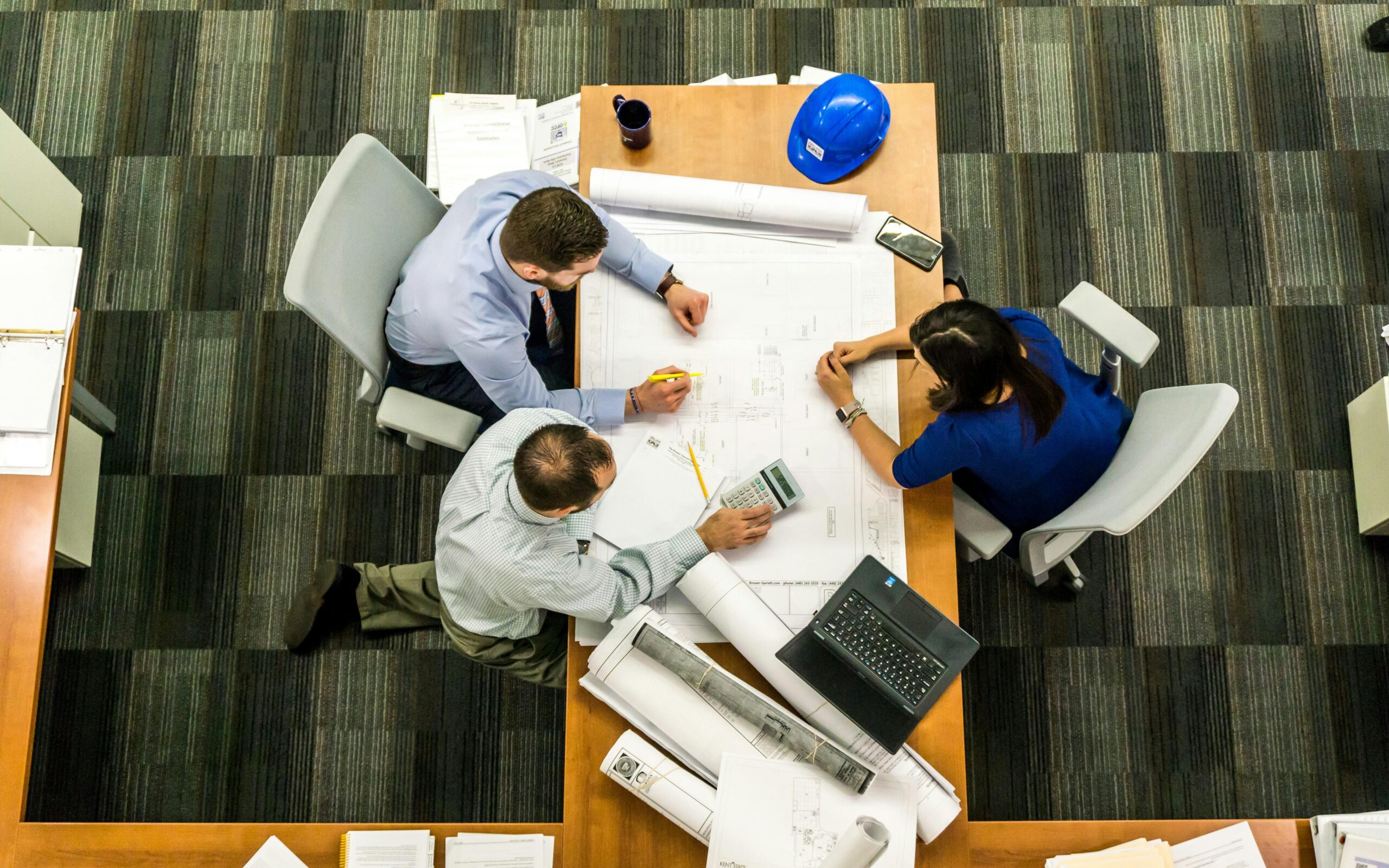 Professionals reviewing building drawings